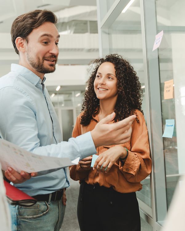 Business people use sticky notes as an agile methodology for productivity when working in the modern office.