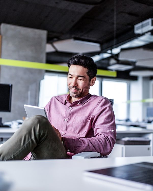 Japanese person working with a digital tablet