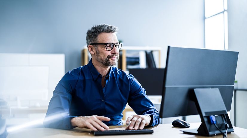 Businessman with business computer in office