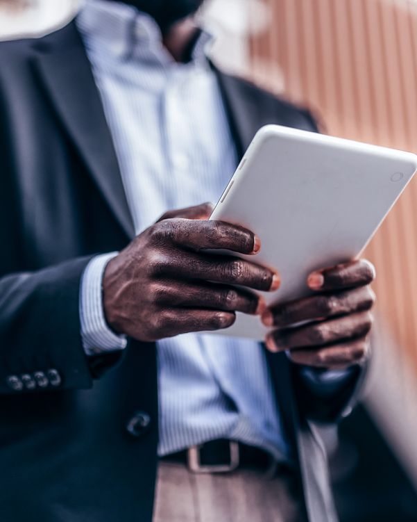 Man in business attire collects data with DocuSign on his tablet