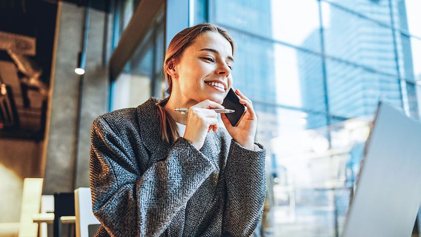 A young woman is talking on her smartphone.