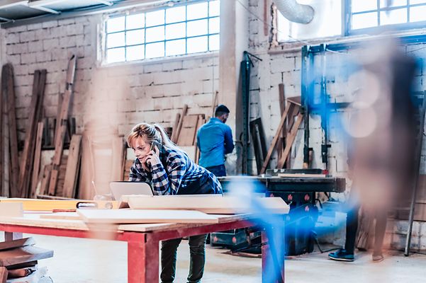 Two employees in a joinery workshop