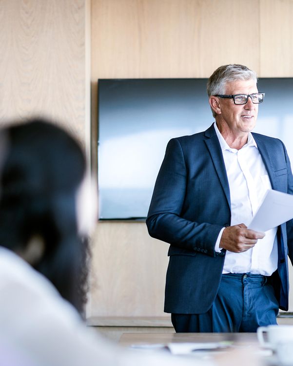 Professional discussion about CloudConnect with colleagues in a meeting