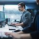 An employee looks at the Cisco Meraki Managed Service dashboard.