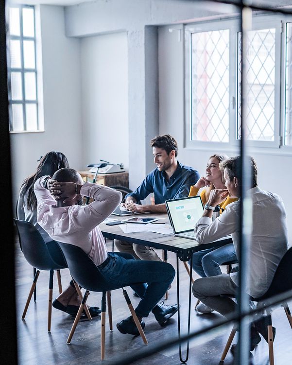 Business team at a meeting about managed services for public cloud infrastructure in the loft office