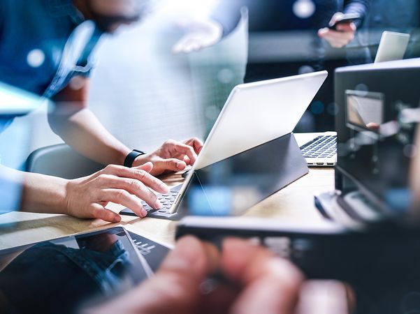 A developer uses a notebook computer.