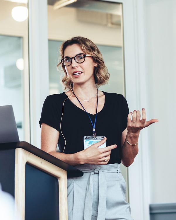 Businesswoman giving a speech during a conference