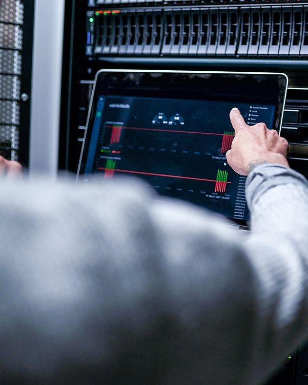 View over the shoulder of a man performing an analysis on a server.