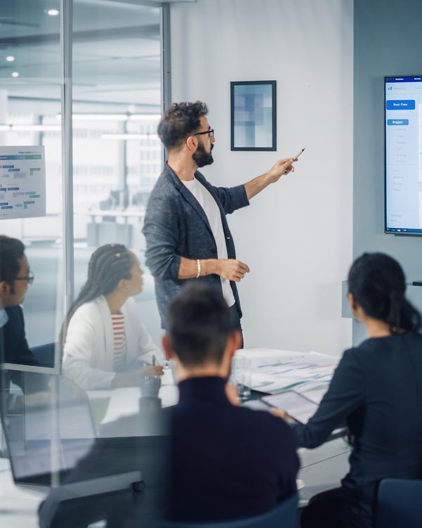 A group of people uses different devices