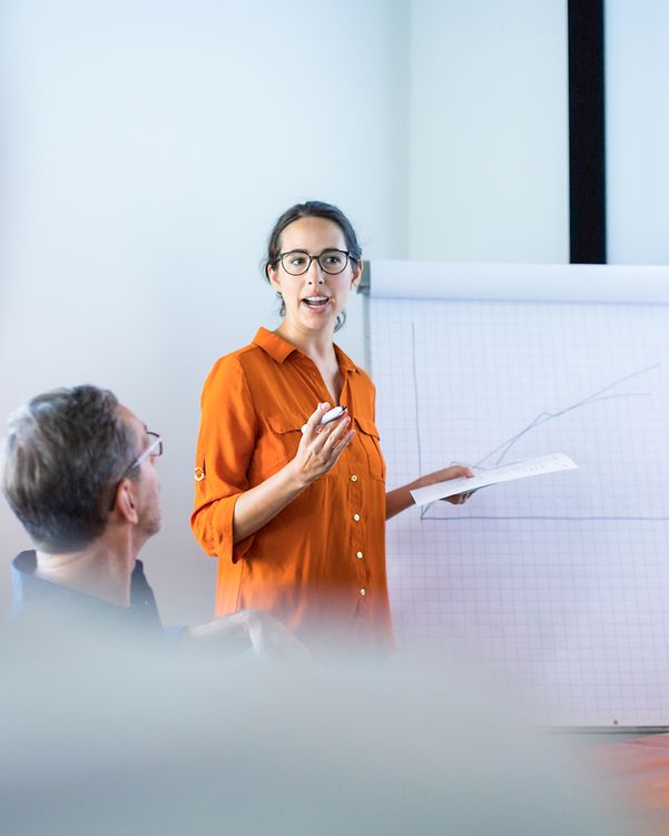 Businesswoman giving a presentation to colleagues
