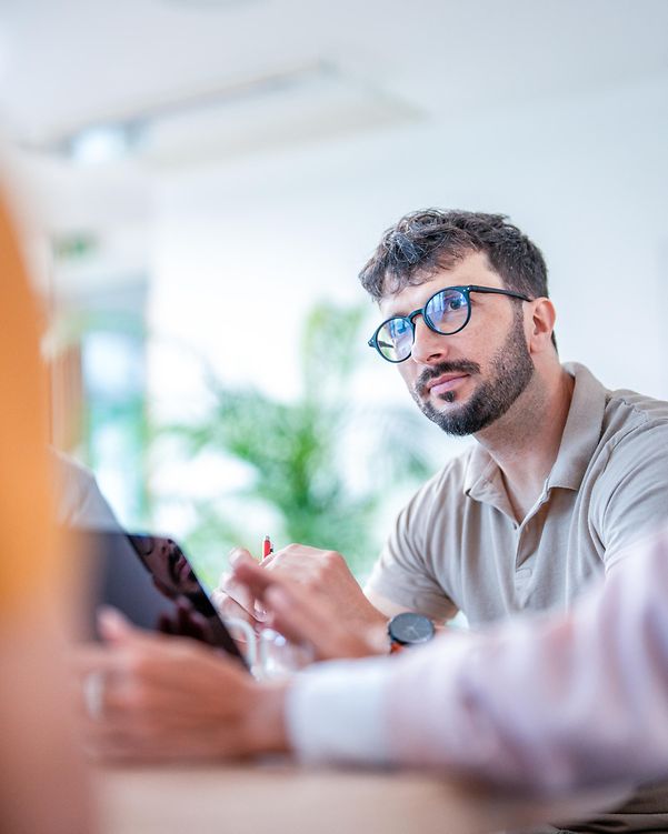 Confident professional conducts interview with customers