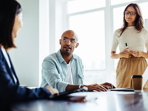 Business people engaged in a discussion during a meeting