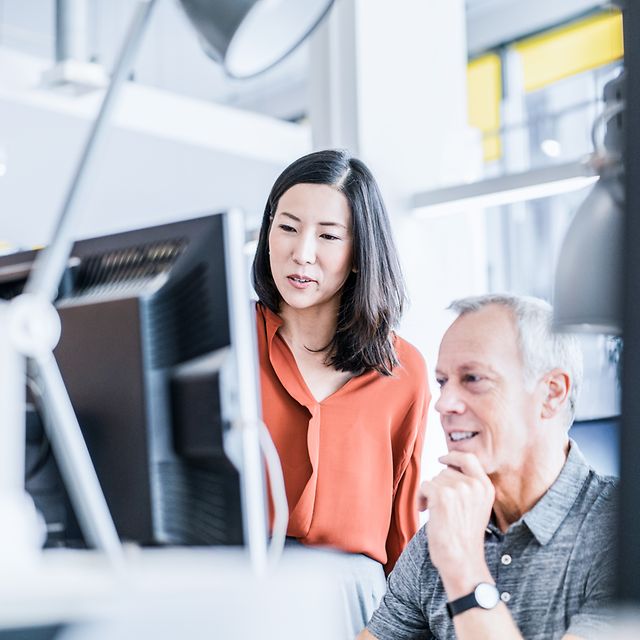 Two IT specialists are looking into UEM Managed Service for their company.