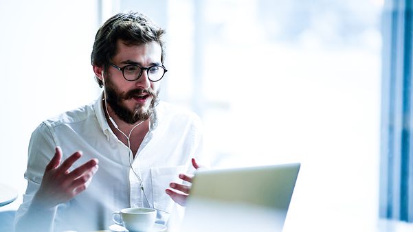 Businessman makes secure mobile calls via Mobile IP VPN.