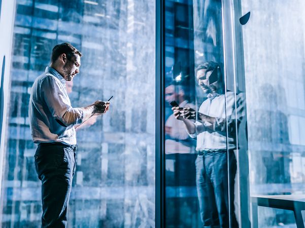 Businessman looking at his smartphone