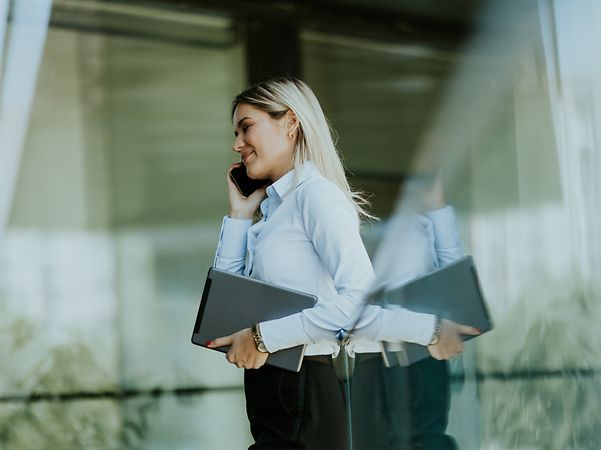 Woman making a phone call with Direct Numbering.