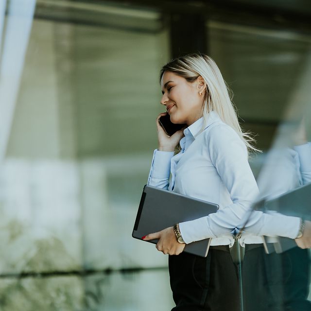 Woman making a phone call with Direct Numbering.