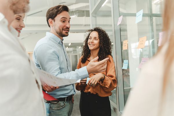 Team plans how they can improve personal interaction in their app.