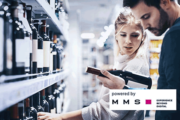 Business analytics in retail shows a couple in front of a wine rack looking at the label on a wine bottle.
