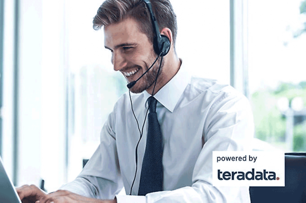 Businessman sitting behind his laptop with headphones in a virtual meeting