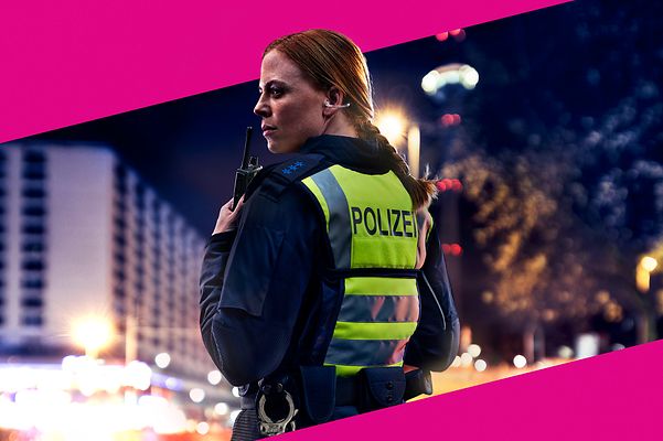Policewoman on duty against a magenta background.
