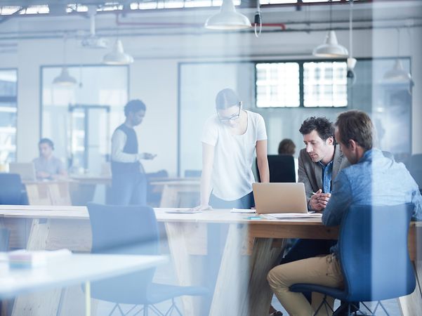 Several colleagues at a start-up discuss their business idea.