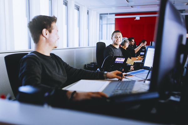 Employees in open-plan offices use Voice AI Notes