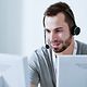 Man makes phone calls using telephony extensions via LANCOM R903 and