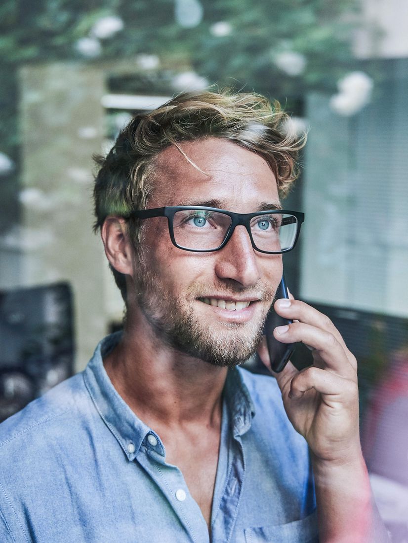 Man talking on a telephone for telephone systems