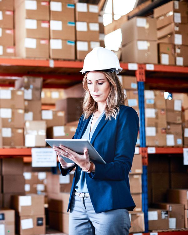 A woman searches the warehouse for the right goods for her online sales generated via marketplaces and comparison portals.