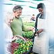 An elderly couple happily shops at the vegetable stall they found thanks to good online reviews.