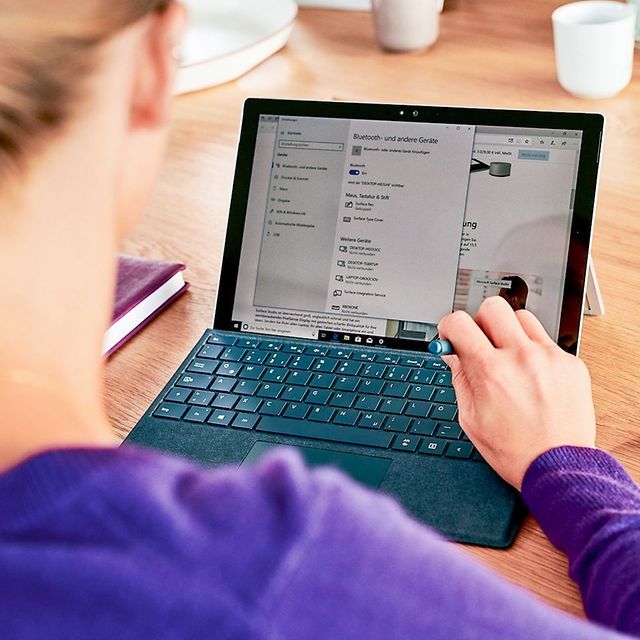 In the foreground is a woman with a laptop, and in the top left corner is the lettering 'Security Cave'.