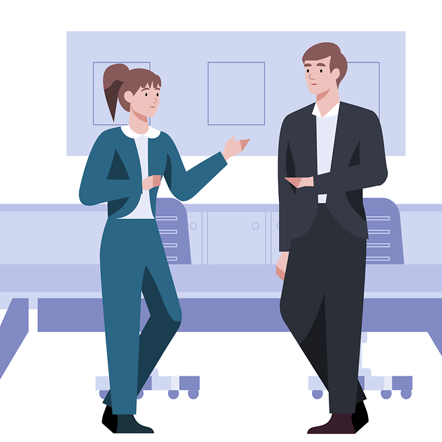 One person explains to another person in an office the contract transfer at Telekom.