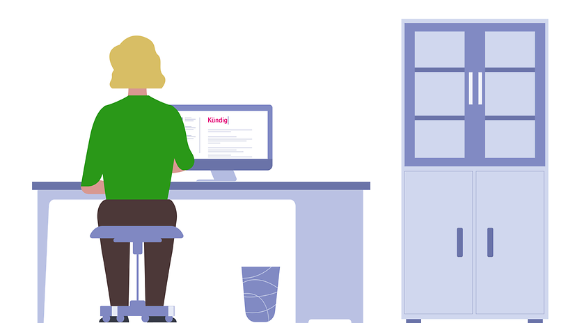 Woman sitting at her office desk, writing her resignation letter on her computer