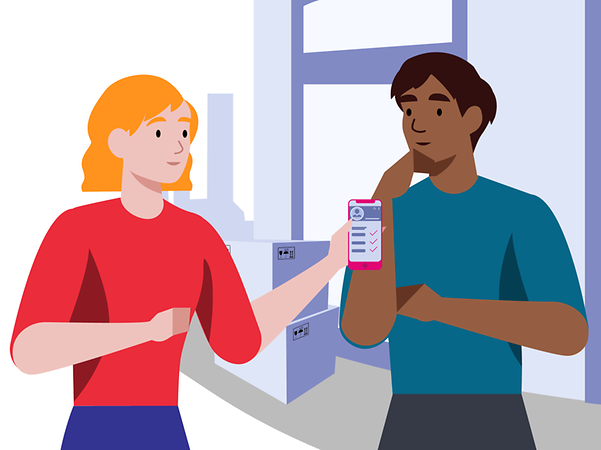 One person shows another person a checklist for moving house on their mobile phone in front of a building with moving boxes.
