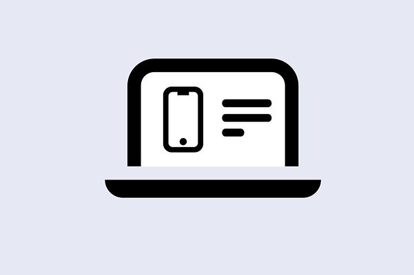 Laptop with a mobile phone, with text next to it