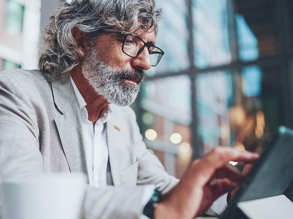 A man working on his tablet.