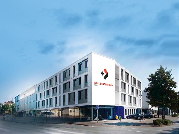 Exterior view of the white-grey company building of Noelle + Nordhorn