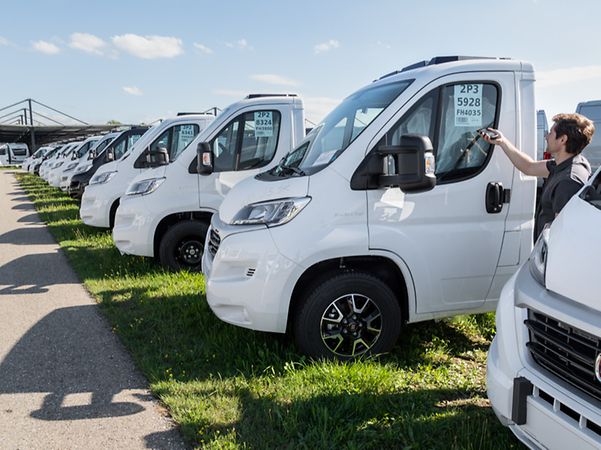 White Dethleffs vehicles parked in the fleet with barcodes