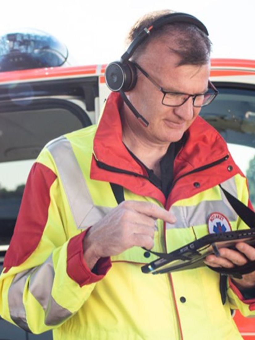Emergency doctor with headset and tablet for FTI Ambulance Video Assist