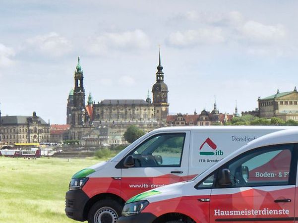 ITB Dresden Company vehicles on the Elbe meadows in front of the Dresden city skyline