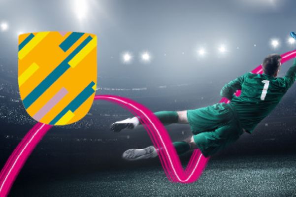 A goalkeeper catching a ball in a grey stadium with a magenta overlay and a protective shield overlay in yellow and green