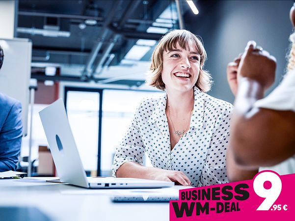Sign reading ‘Business World Cup Deal: just €9.95 for Telekom Business DSL’, featuring a woman on the phone in front of a laptop