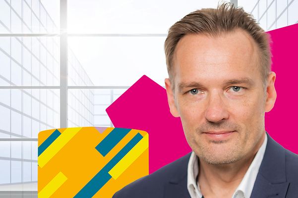 The picture shows a portrait of Olaf Reimann from Telekom Security